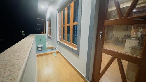 NārāyangarhChitwan Comforts Apt 2的享有房子内带游泳池的房间的景色