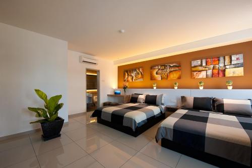Katil atau katil-katil dalam bilik di Rivero Boutique Hotel Melaka