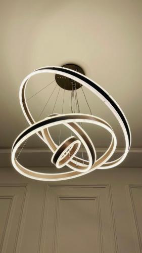 a metal chandelier hanging from a ceiling at Villa michlo in El Makina