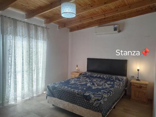 Postel nebo postele na pokoji v ubytování Departamento Stanza