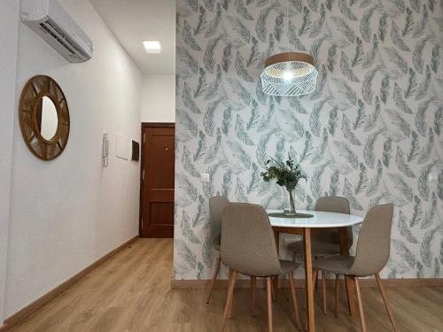 a dining room with a table and chairs at Casa Yaye Puerta Palma - Écija in Écija