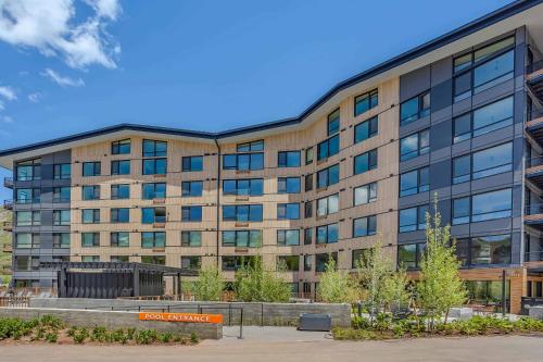 an office building with glass windows on the side at Electric Pass Lodge 502 by Snowmass Mountain Lodging in Snowmass