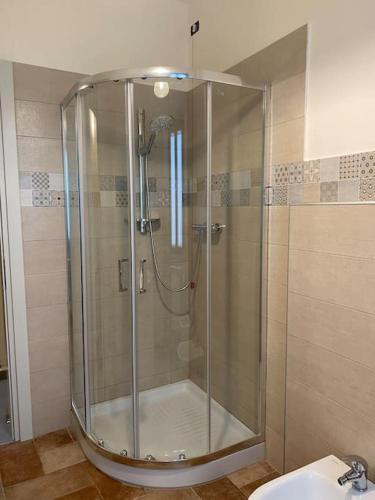 a shower with a glass door in a bathroom at Casa DOLCE VITA centro di Pistoia in Pistoia