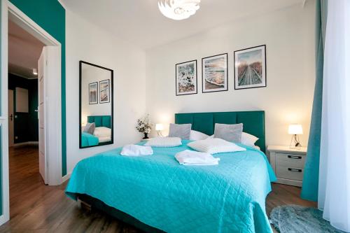 Ένα ή περισσότερα κρεβάτια σε δωμάτιο στο Baltic Waves Resort by Baltic Home