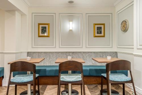 a restaurant with two tables and two chairs at Princes Square in London