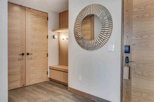 a hallway with a mirror on the wall at One Snowmass West 303 by Snowmass Mountain Lodging in Snowmass
