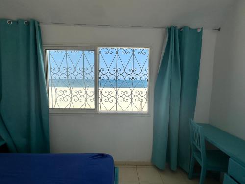 Ένα ή περισσότερα κρεβάτια σε δωμάτιο στο Villa au bord de mer