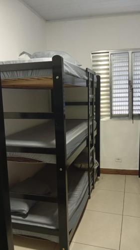 Μία ή περισσότερες κουκέτες σε δωμάτιο στο TECH Hostel