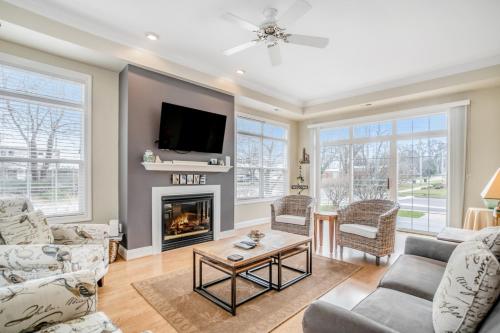 a living room with a fireplace and a tv at Beacon Court Condo F in Douglas