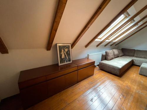 a living room with a couch and a table at Snow White Chalet in Brezovicë