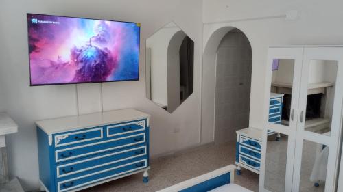 Televízia a/alebo spoločenská miestnosť v ubytovaní Interstellar