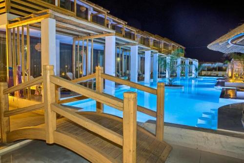 a view of a swimming pool at night at Alia Suites and Spa in Haraki