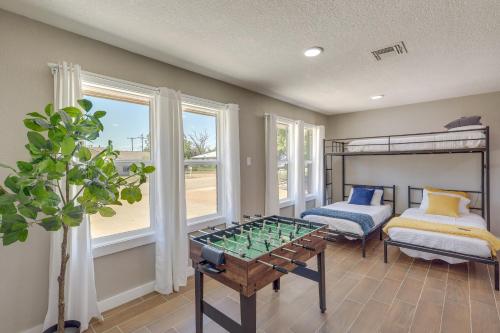 a living room with a table and a bunk bed at Temple Family Home 4 Mi to Dtwn! in Temple