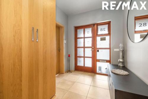 a room with a kitchen with a counter and a door at Amazing Villa With Hot Tub Near Reykjavík in Lágafell