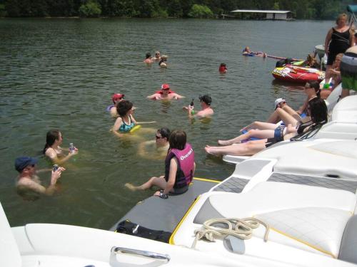 a group of people in the water on boats at Old Kinderhook Castle in Roach