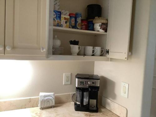 a kitchen with a coffee maker on a counter at Old Kinderhook Castle in Roach