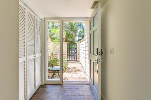 a hallway with a door leading to a patio at Golf Course Views and Beach Access Shipyard Villa in Hilton Head Island