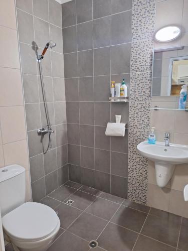 a bathroom with a toilet and a sink at Studio Anelia in Sveti Vlas