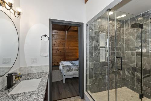a bathroom with a walk in shower and a glass shower stall at Quiet Mountain Cabin in Lake Arrowhead