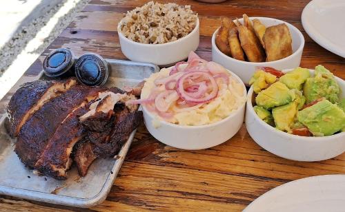 a table with bowls of food on a table at Pool Breeze 202 in Punta Cana