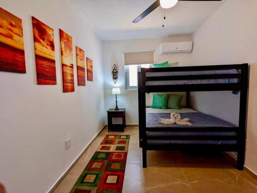 a bedroom with a bunk bed in a room at Ocean Front Apartments in Arecibo