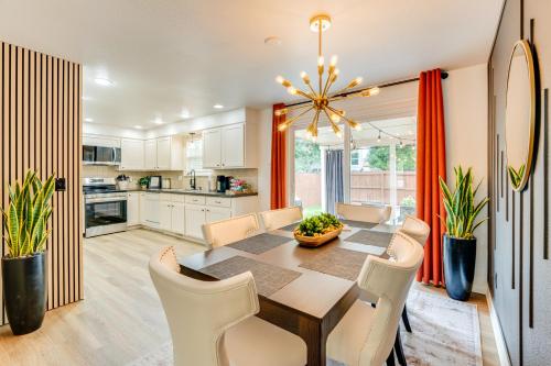 a kitchen and dining room with a table and chairs at Loveland Retreat Near Dtwn with Outdoor Dining! in Loveland