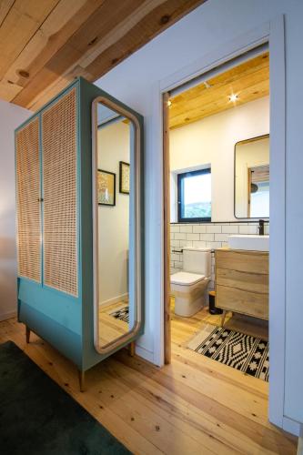 a bathroom with a blue cabinet and a sink at El Descansadero in Los Narros