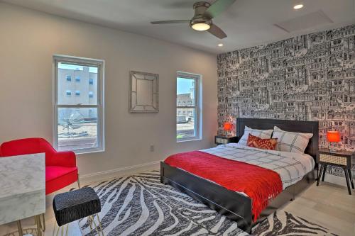 a bedroom with a red bed and a red chair at Live Loftily at University City in Philadelphia