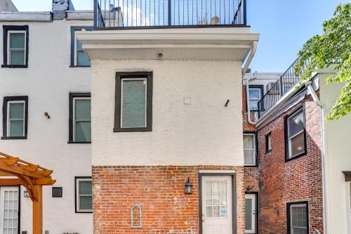 a brick building with a balcony on top of it at Live Loftily at University City in Philadelphia