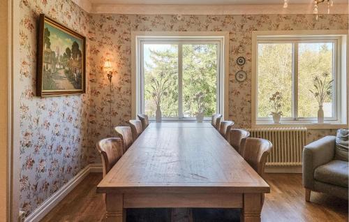 a conference room with a long table and chairs at Nice Apartment In Landeryd With Wifi in Långaryd