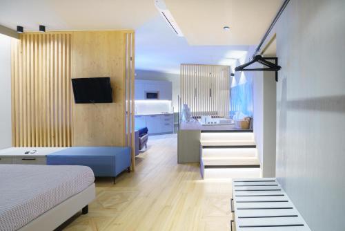 Postel nebo postele na pokoji v ubytování Atarassia suite luxury