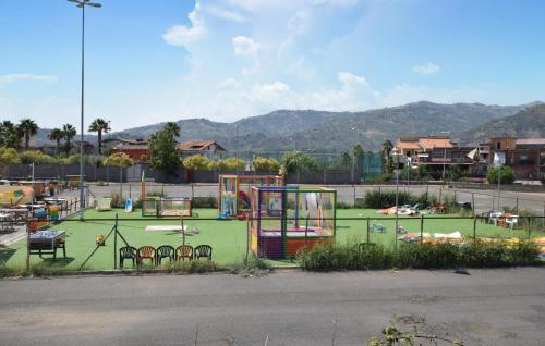 a playground with tables and chairs in a park at Villa Rossella in Gaggi