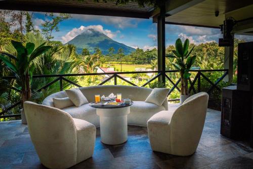 a living room with a view of a mountain at Hotel Boutique Casa Del Rio in Fortuna