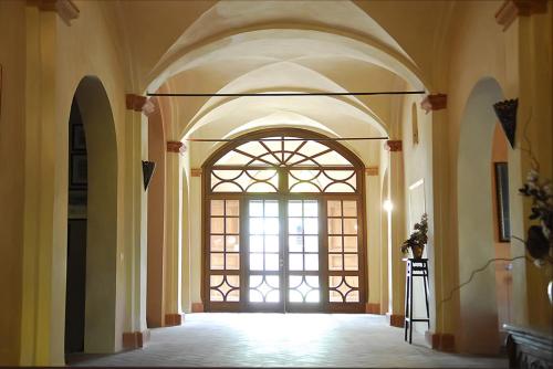 an empty hallway with a large window in a building at R&B Villa Tartaruga in Castelfranco Emilia