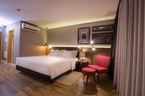 Postel nebo postele na pokoji v ubytování QS Marista Hotel by Atlas