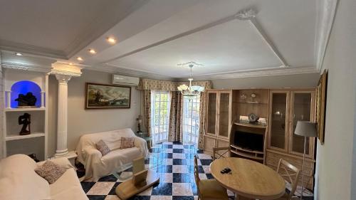 a living room with a couch and a table at piso en arenas de velez malaga in Málaga