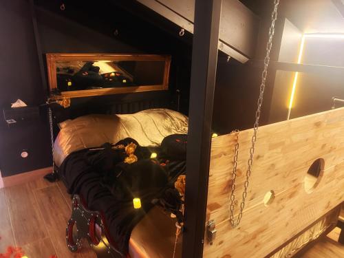 a room with a bed in a room with at Love Room Luxure 50 Nuances in Jonzac