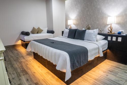 Postel nebo postele na pokoji v ubytování Hotel Boutique Casa Del Rio