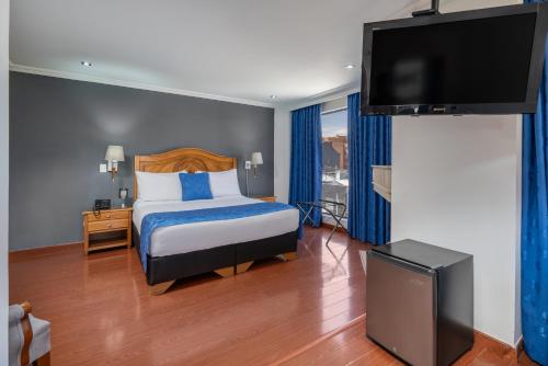 Postel nebo postele na pokoji v ubytování Hotel Egina Bogotá