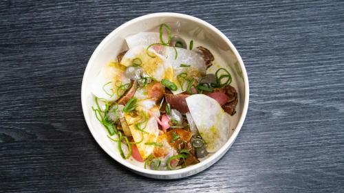 a bowl of food sitting on a table at Smaken av Ryfylke Event AS overnatting, Bygningen drives ikke som hotell in Hjelmeland