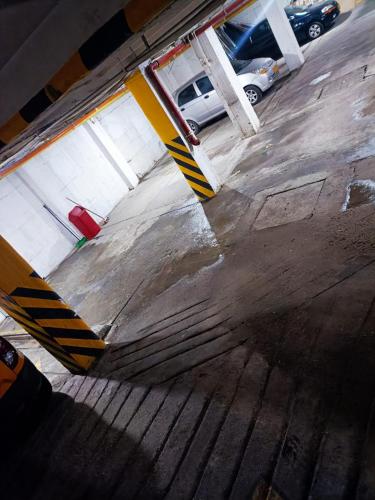a view of a parking lot with a parking garage at Hotel Armenia Lions in Armenia