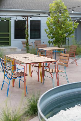 a group of tables and chairs in a patio at Talbot Commons Hotel in Taylor