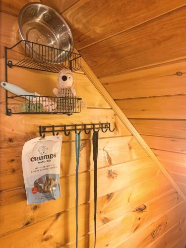 an attic room with a wooden floor and a shelf with a bag at Downward Dog Lodge - Hot Tub, Pool Table, Fireplace, Yoga Den in Blue Ridge