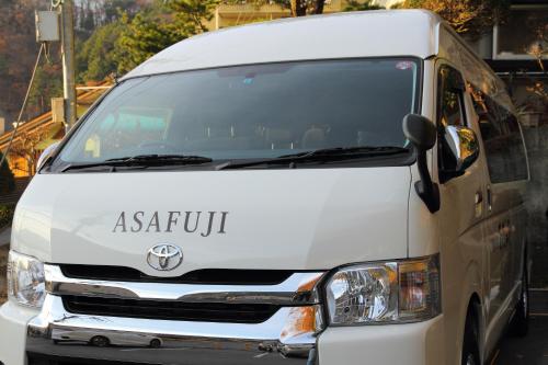 a white van is parked on a street at Hotel Asafuji in Fujikawaguchiko