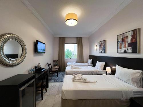 Postel nebo postele na pokoji v ubytování Hussein Hassan Ali Bayari Hotel