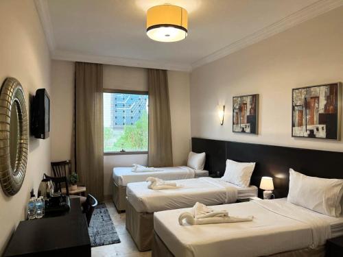 Postel nebo postele na pokoji v ubytování Hussein Hassan Ali Bayari Hotel