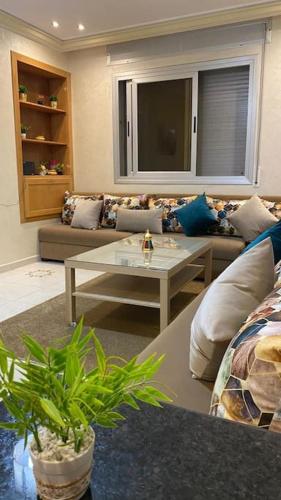 a living room with a couch and a coffee table at apartamento la fontana 2 in Charf