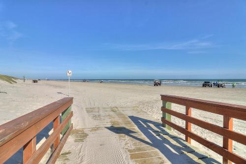 a view of a beach with a fence and the ocean at The Pearl of Port A GW108 in Port Aransas