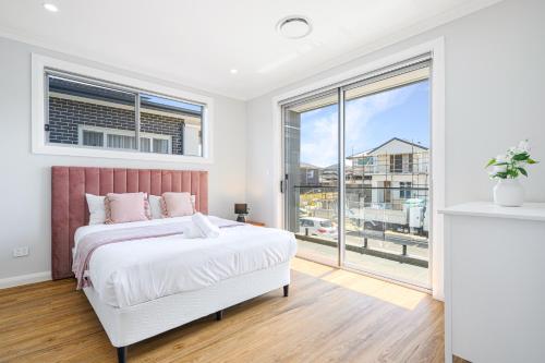 Ένα ή περισσότερα κρεβάτια σε δωμάτιο στο Campbelltown Sweet 5Br house with WiFi&Parking