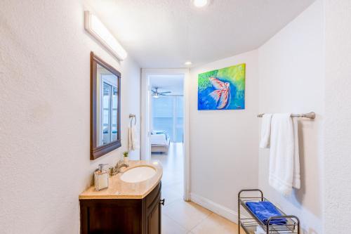 a bathroom with a sink and a mirror at Beach Front Condo, Sea View, Beach Access, Balcony in Fort Lauderdale